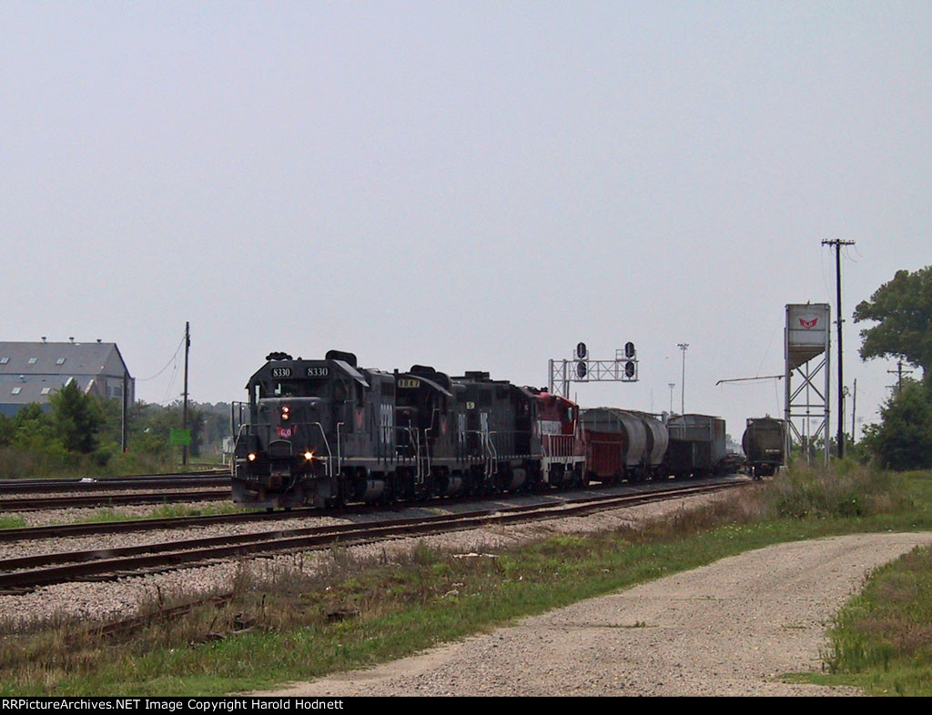 NCYR 8330 leads a train making a pickup 